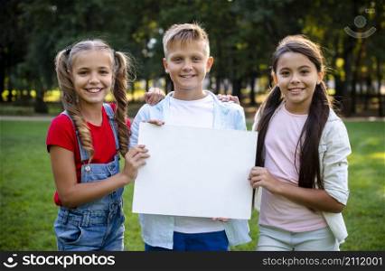 two girls boy holding poster their hands
