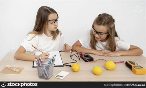 two girls doing science experiments