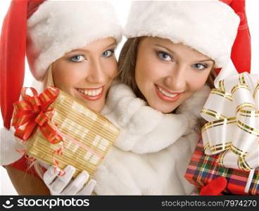 Two Girls Dressed as Santa Claus Happily Hold Boxes With Gifts