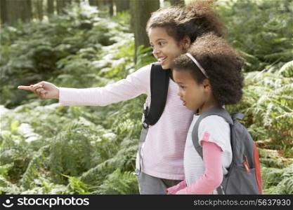 Two Girls Exploring Woods Together