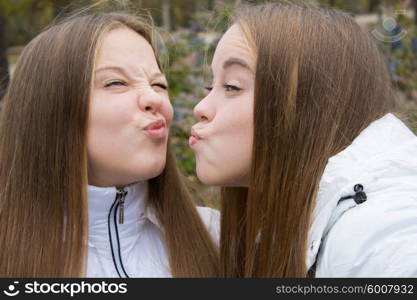 Two girls friends pouting