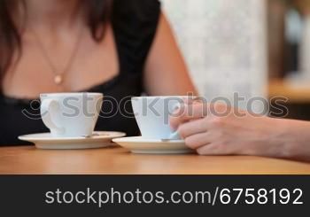 Two girls having coffee in Cafe