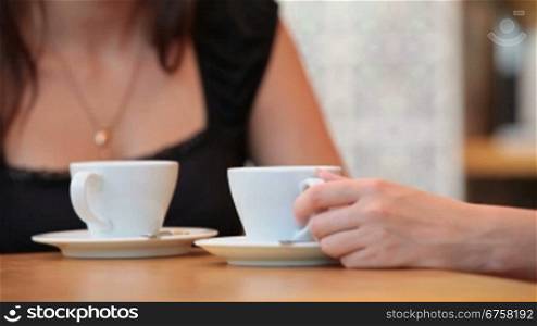 Two girls having coffee in Cafe