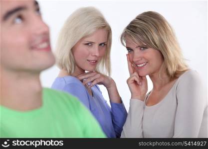 Two girls lusting over man
