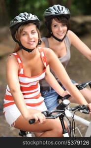 Two girls on a bicycle