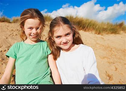 Two girls on beach, portrait