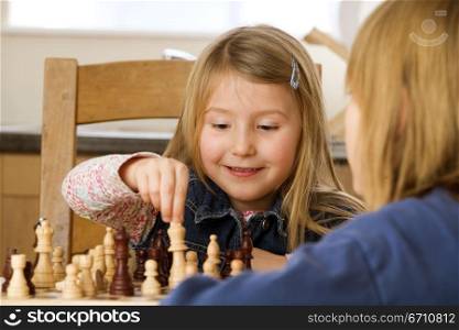 Two girls playing chess