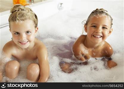 Two Girls Playing In Bath Together