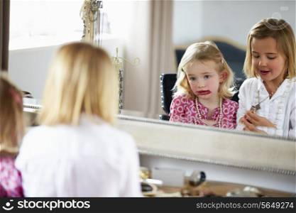Two Girls Playing With Jewelry And Make Up