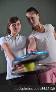 two girls recreating tennis sport