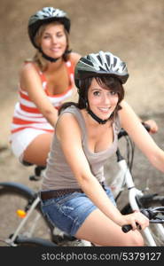 Two girls riding bikes