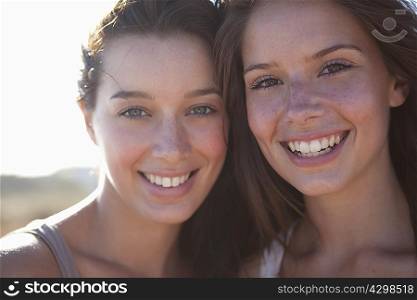 Two girls smiling in camera