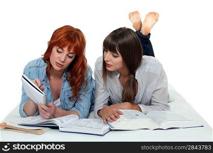 Two girls studying together
