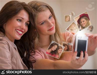 Two girls taking selfie by smartphone