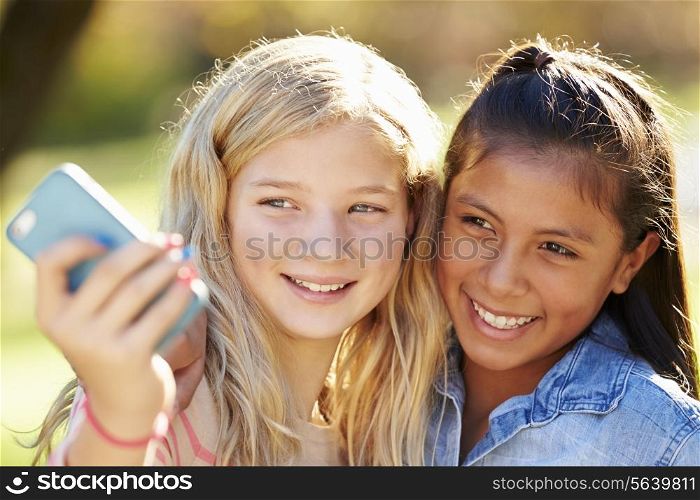 Two Girls Taking Selfie With Mobile Phone