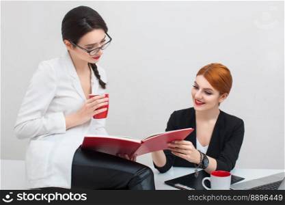 two girls talking in the office