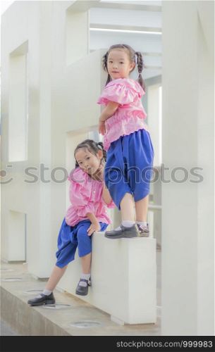 Two girls wearing Thai clothes