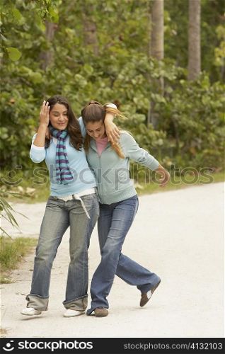 Two girls with their arms around each other