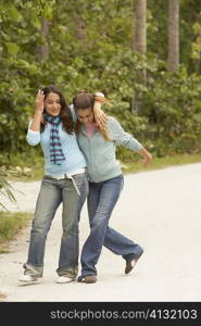 Two girls with their arms around each other