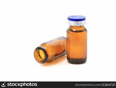 two glass bottles with medicine overn white background
