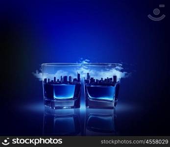 Two glasses of blue liquid. Image of two glasses of blue liquid with city illustration in