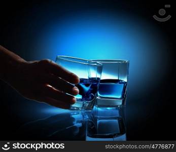 Two glasses of blue liquid. Image of two glasses of blue liquid