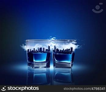 Two glasses of blue liquid. Image of two glasses of blue liquid with city illustration in
