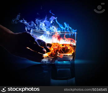 Two glasses of burning absinthe. Image of two glasses of burning absinthe