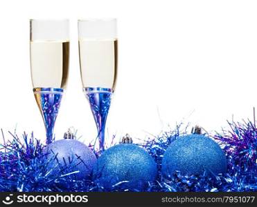 two glasses of champagne at blue and violet Christmas decorations isolated on white background