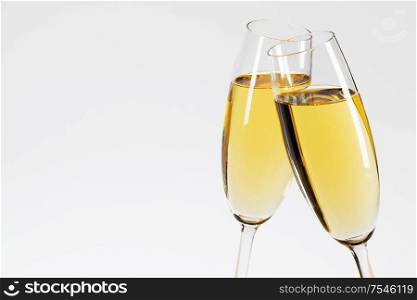 Two glasses of champagne on white background. Two glasses of champagne