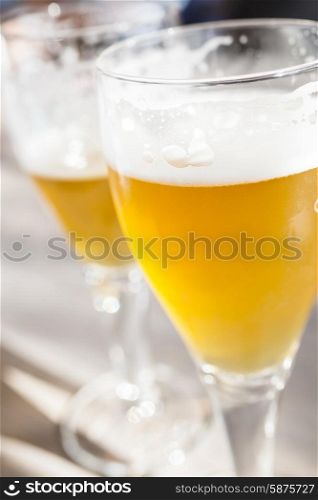 Two glasses of golden lager beer