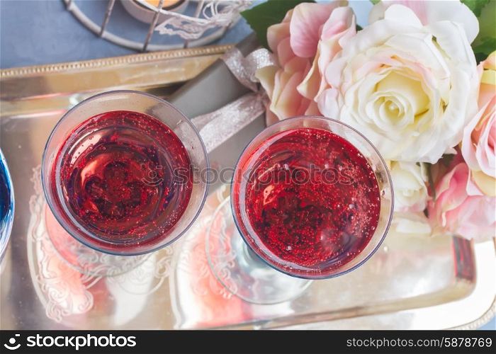 Two glasses of pink champagne, top view