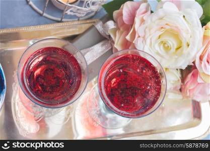 Two glasses of pink champagne, top view