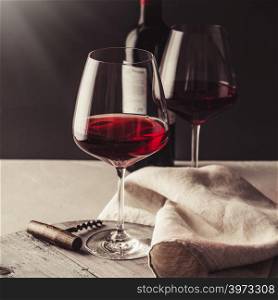 Two Glasses of red wine on concrete background. Glasses of red wine on concrete background