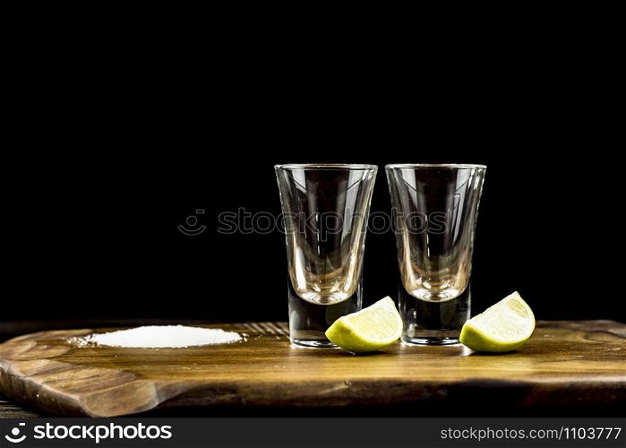 two glasses of tequila with lime and salt