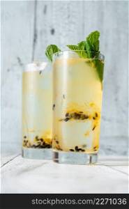 Two glasses of Waltzing Matilda Cocktail decorated with fresh mint sprigs