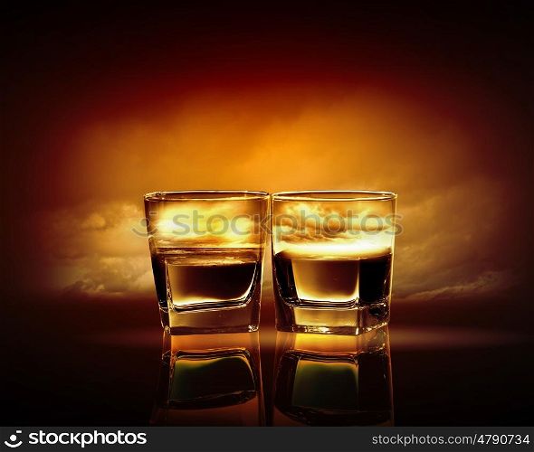 Two glasses of whiskey. Two glasses of whiskey with sea illustration in against sky background