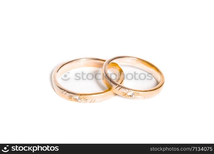 two golden wedding rings isolated on white, wedding rings background concept