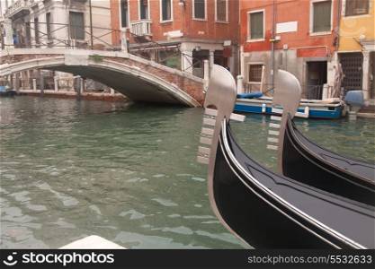 Two gondola in Venice near pier and bridge&#xA;