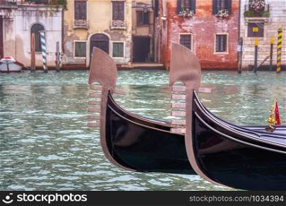 Two gondolas sailing through a canal in Venice, Italy.