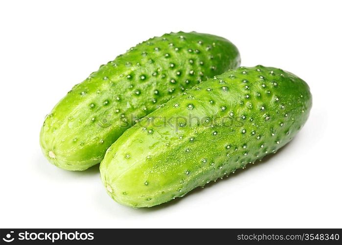 Two green cucumbers isolated on white background