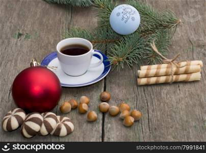 two groups of cookies, coffee, Christmas tree decorations and coniferous branch, still life, subject Christmas and New Year