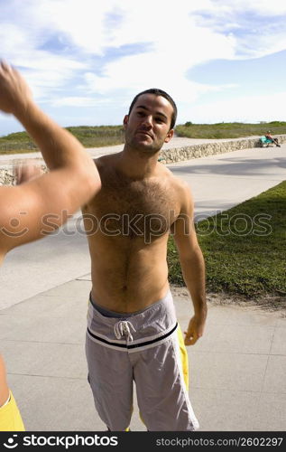 Two guys high fiving each other