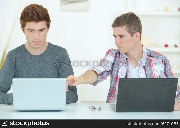 Two guys studying
