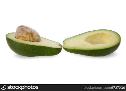 two halves of avocado fruit isolated on white