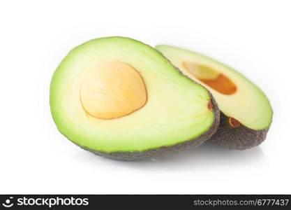 two halves of avocado isolated on white