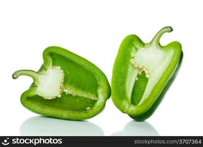 Two halves of green sweet pepper isolated on the white background