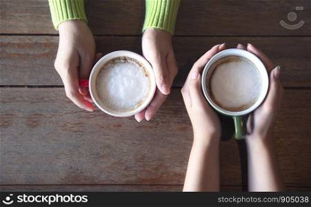 Two hand Holding Coffee Cup