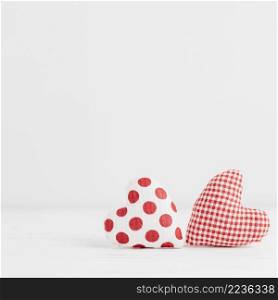 two handmade heart shaped toys