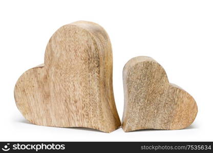 Two handmade wooden carved hearts isolated on white background couple relationship Valentine day concept. Two wooden hearts on white